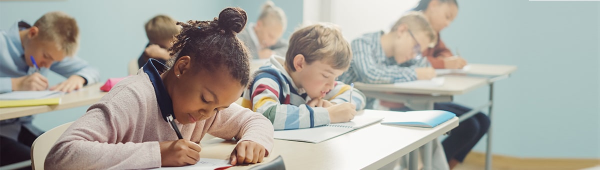 Classroom full of students working diligently.